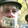 man with money over his mouth