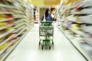 A woman shopping in a grocery store/supermarket