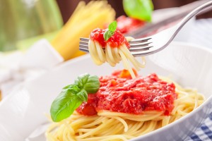 Italian Spaghetti with tomato sauce on traditional home towel