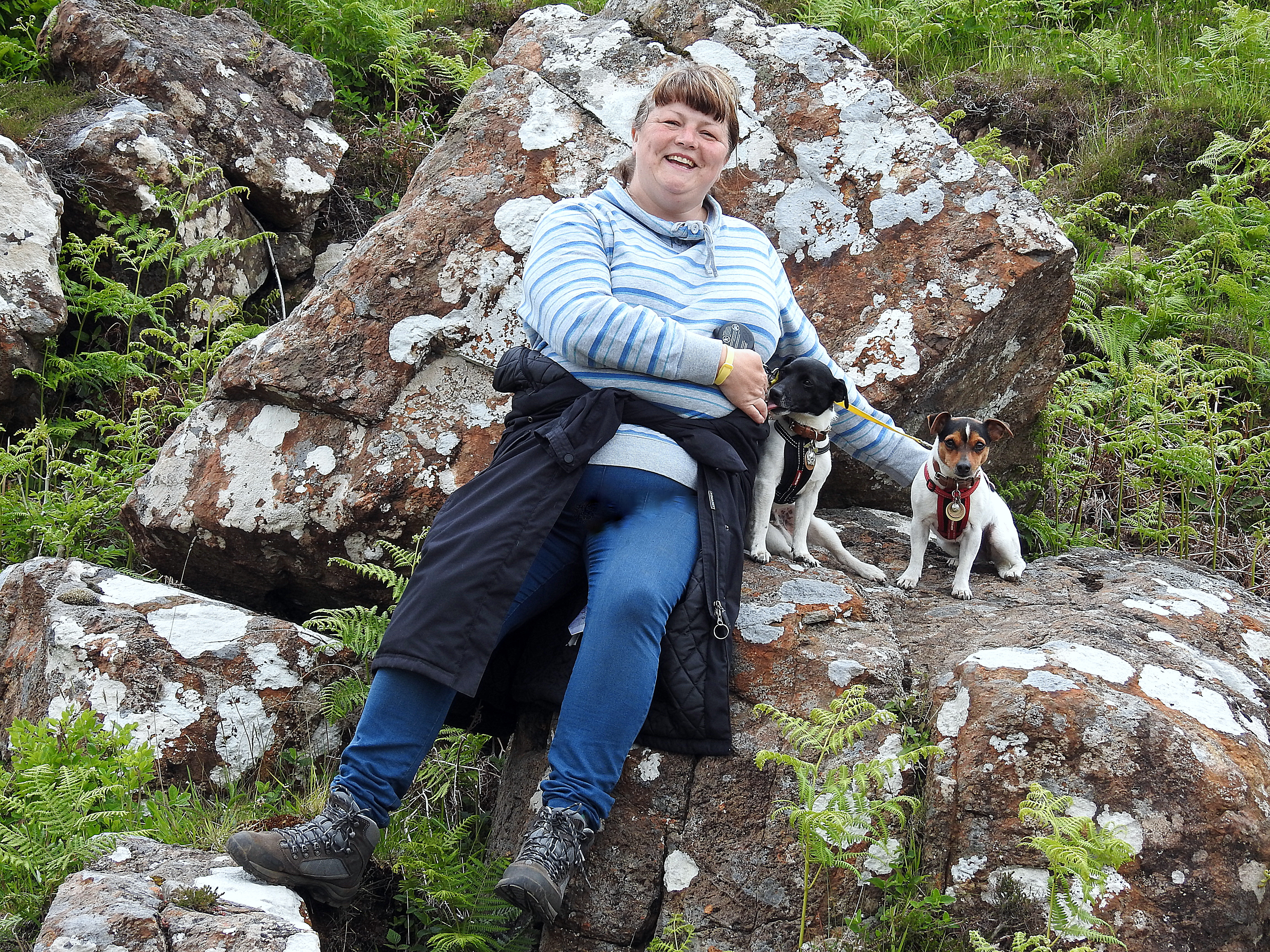 woman smiling with two dogs